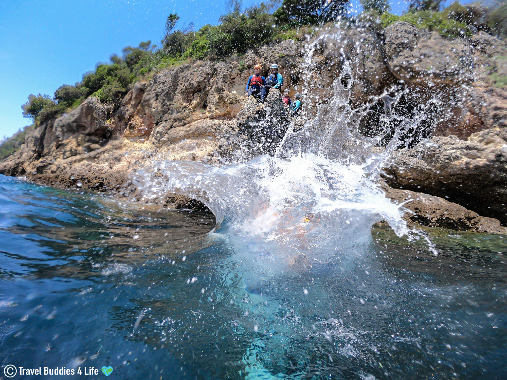 A Big Splash After Entering the Water from a Cliff Jump in Portugal