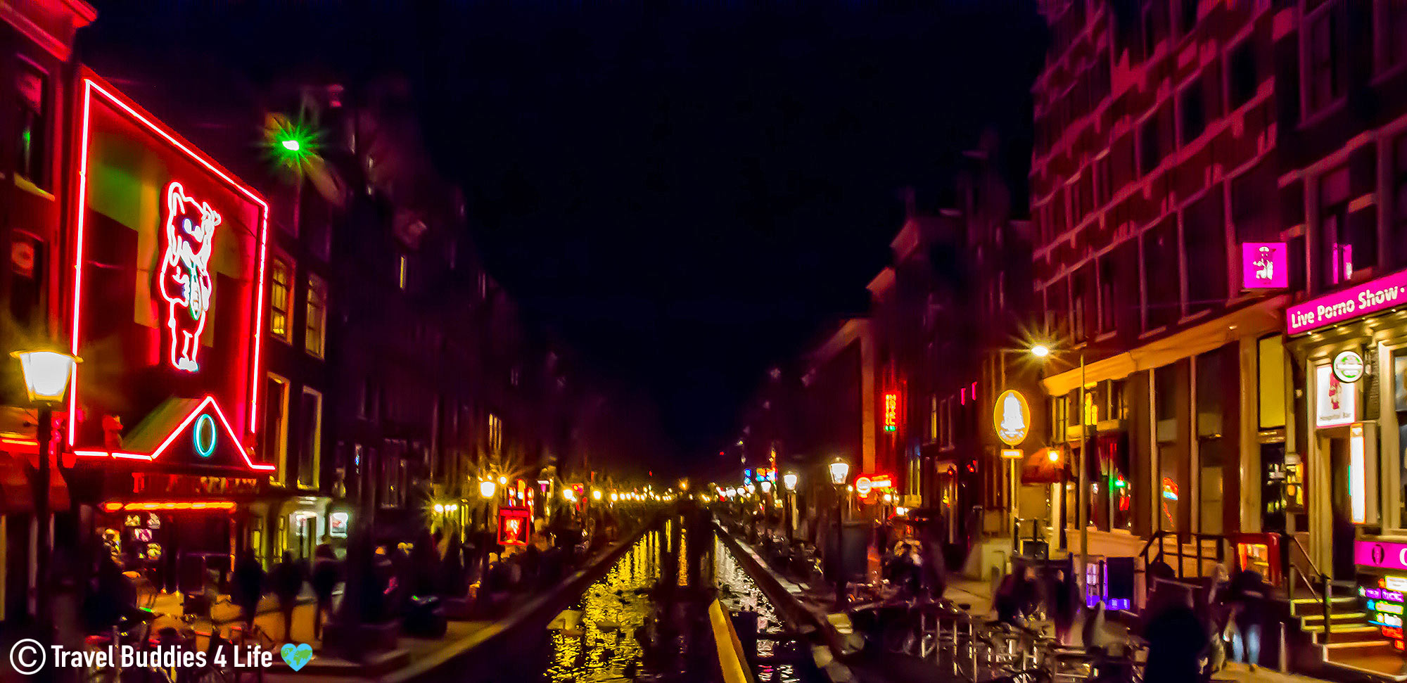 A Nighttime View Of The Canal In The Red Light District In The Netherlands, Europe