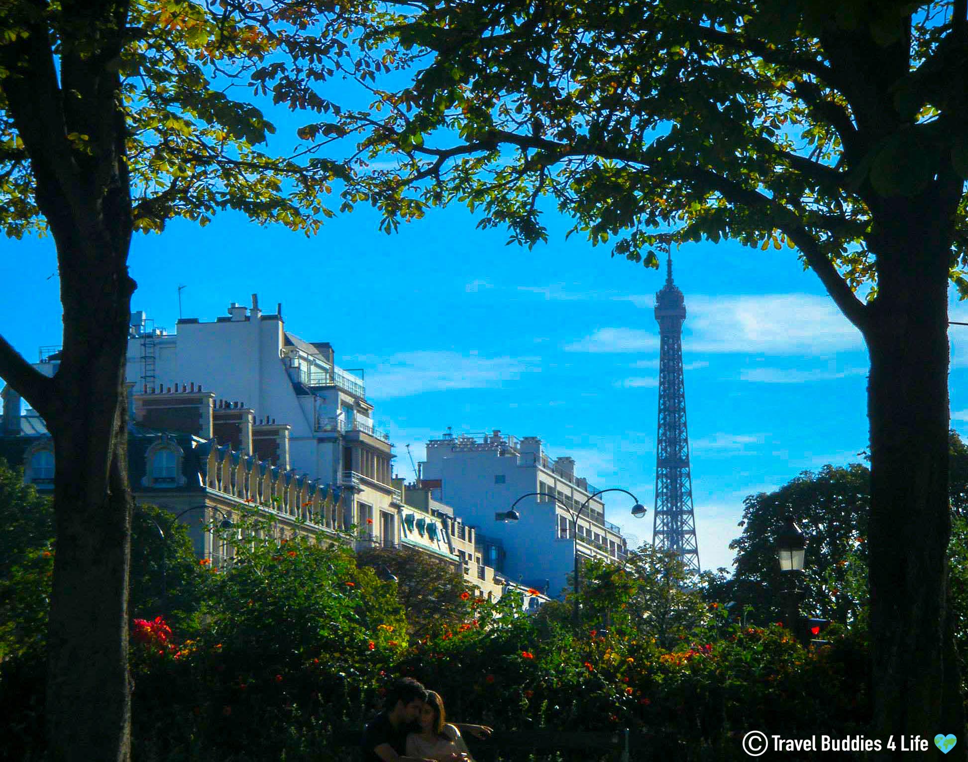 A Pair Of Lovers In Paris With The Eiffle Tower In The Distance, France, Europe