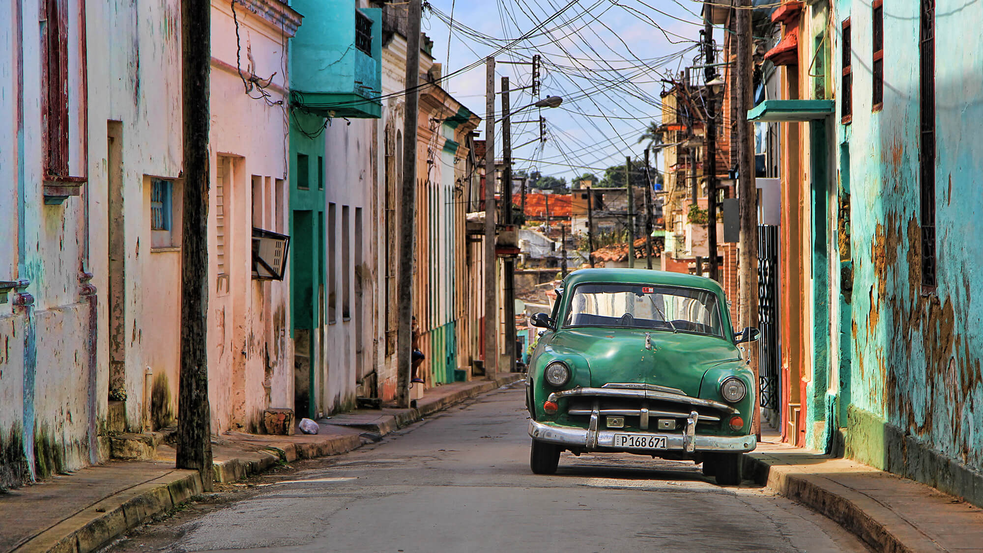 Cuban Streets with a Green Old Fashioned Car