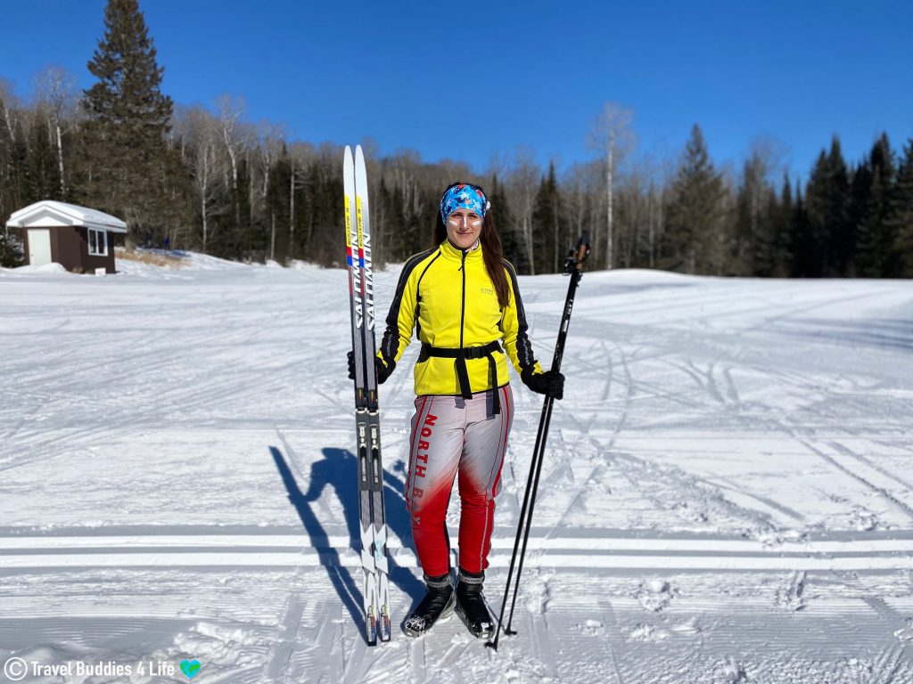Nadine Standing with her Ski's and Sunscreen on her Face