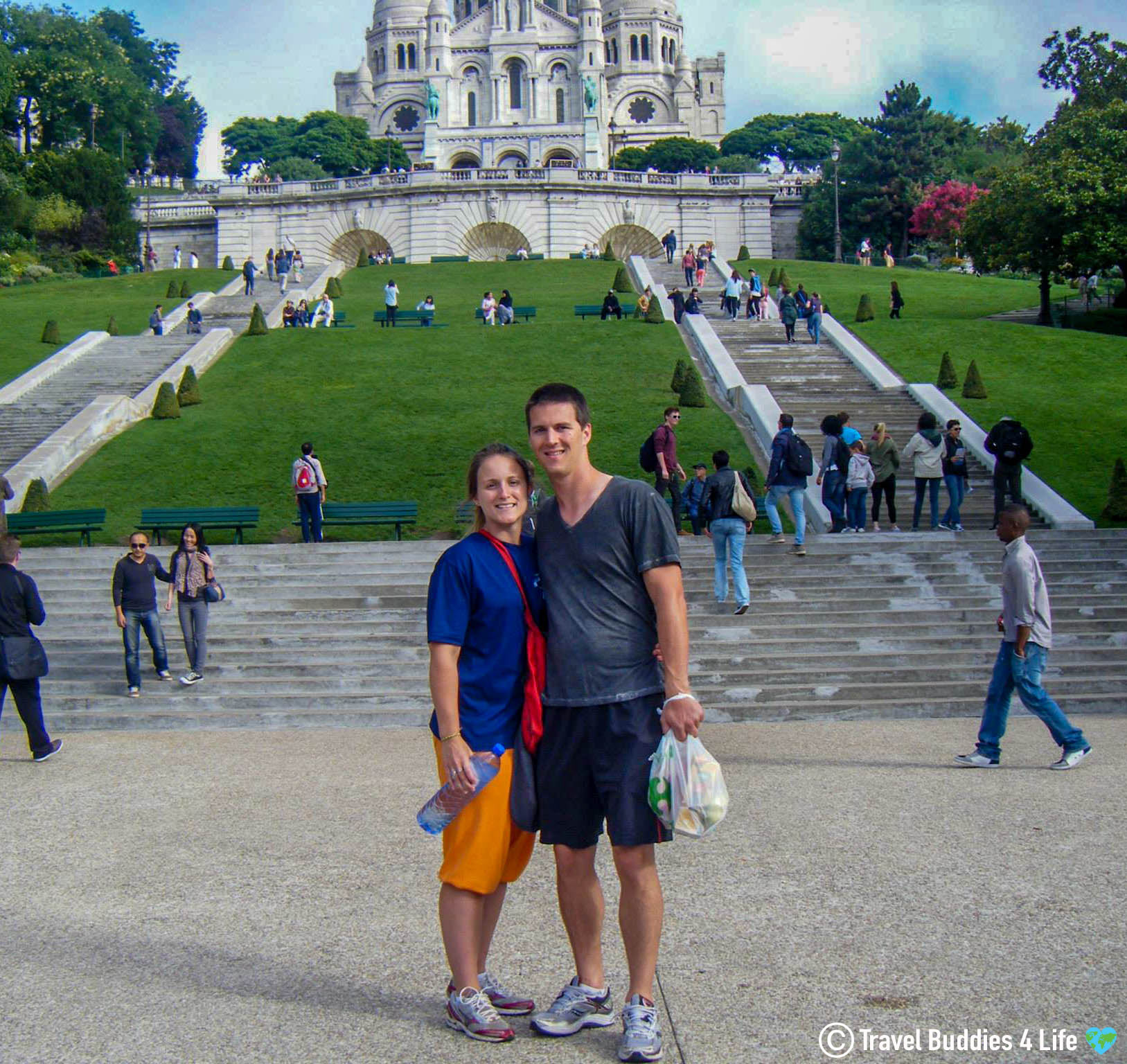 Traveling Couple Joey And Ali At The Foot Of Sacre Coeur In Paris, France